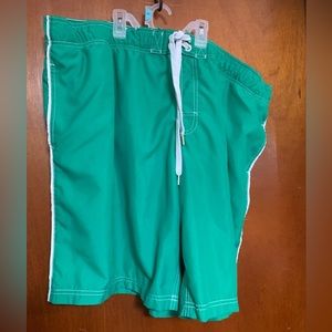 Men’s 2X Faded Glory green swim trunks. Worn area on waist band.